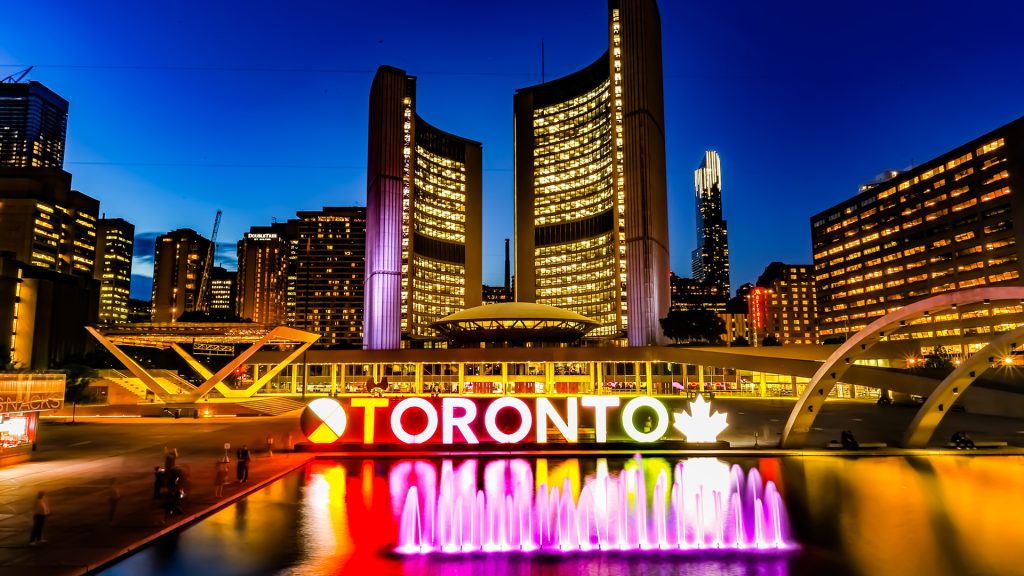 Toronto sign lit up in front of City Hall.